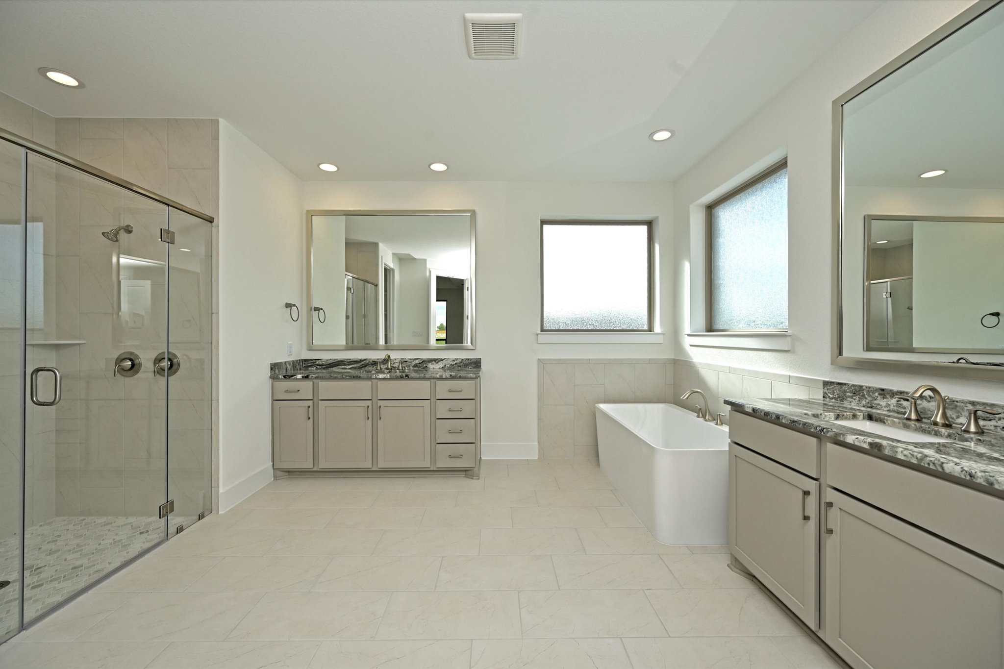 209 Scofield Avenue Georgetown, TX 78626 - Photo 20 of 33 a bathroom with a double vanity sink a toilet a mirror and shower