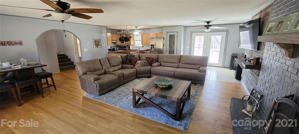 787 Cleghorn Mill Road Rutherfordton, NC 28139 - Photo 13 of 32 a living room with furniture and a wooden floor