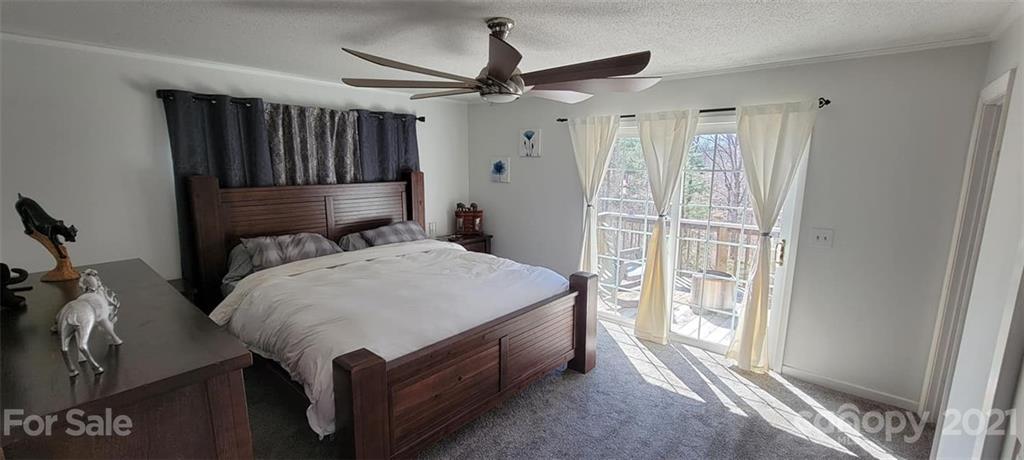 787 Cleghorn Mill Road Rutherfordton, NC 28139 - Photo 20 of 32 a bed room with a bed and a window