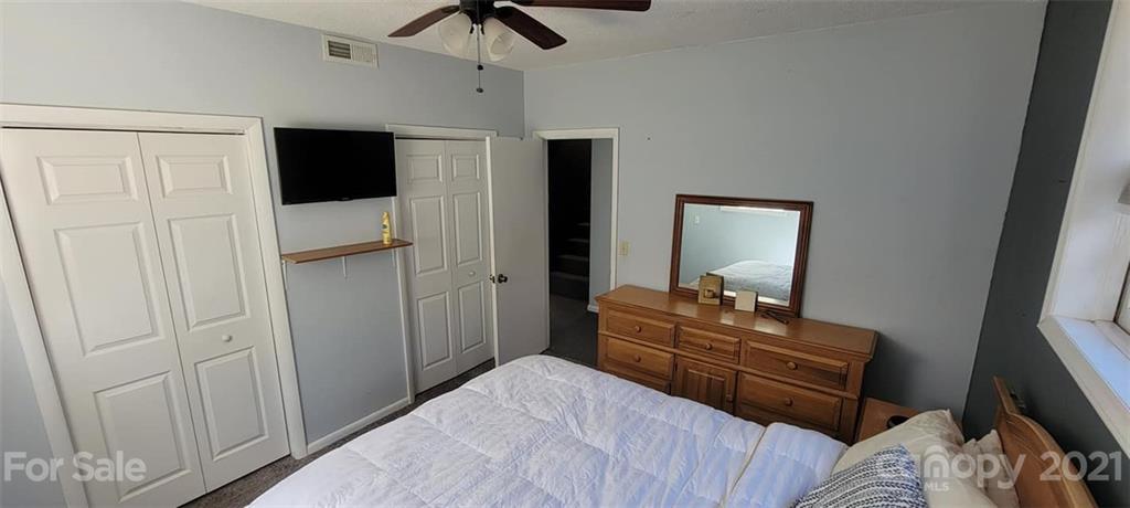 787 Cleghorn Mill Road Rutherfordton, NC 28139 - Photo 31 of 32 a bedroom with a bed and a television