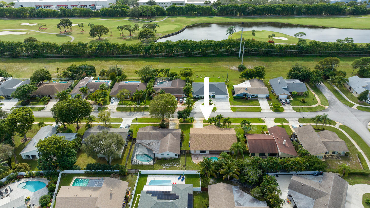 4695 Brandywine Drive Boca Raton, FL 33487 - Photo 23 of 28 a view of a lake with a house with a lake view