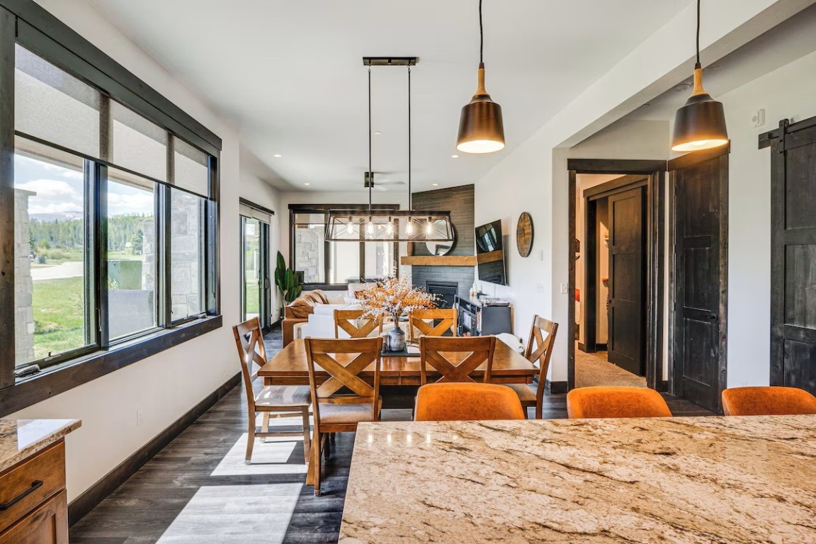 72 Meadow Trail, Unit 104 Fraser, CO 80442 - Photo 1 of 21 a bedroom with furniture and large windows