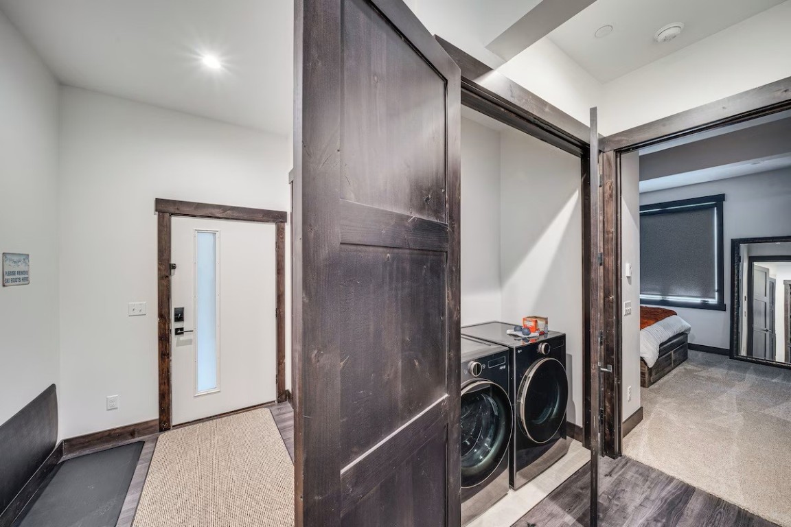 72 Meadow Trail, Unit 104 Fraser, CO 80442 - Photo 15 of 21 a view of a hallway with a washer and dryer
