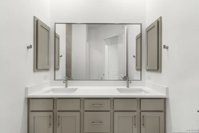 a bathroom with a sink and a mirror