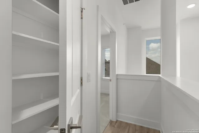 a view of an empty walk in closet