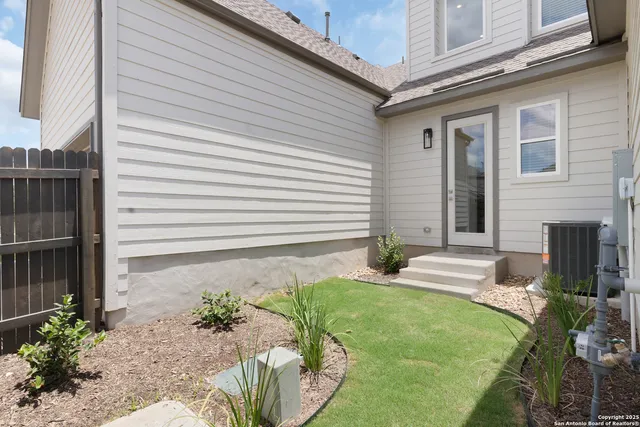 a front view of house with garage and green space