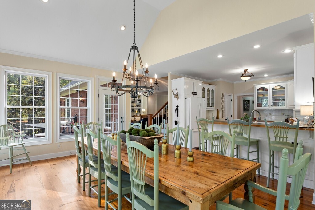 426 Wadley Coleman Lake Road Swainsboro, GA 30401 - Photo 17 of 79 a view of a dining room with furniture and wooden floor
