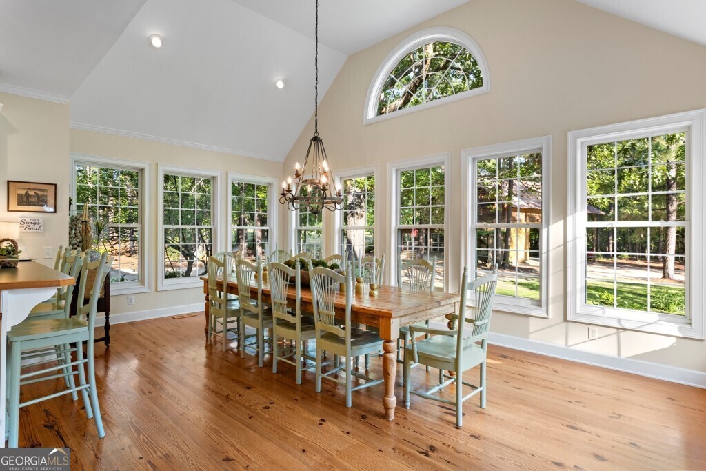 426 Wadley Coleman Lake Road Swainsboro, GA 30401 - Photo 18 of 79 a view of a dining room with furniture window and wooden floor