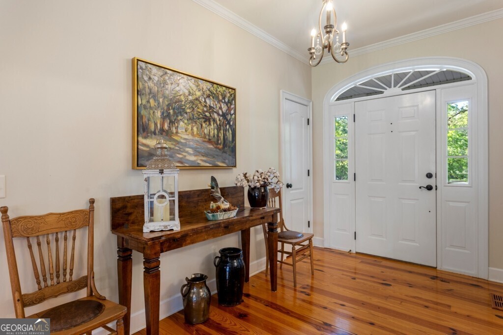 426 Wadley Coleman Lake Road Swainsboro, GA 30401 - Photo 27 of 79 a view of a workspace with furniture and wooden floor