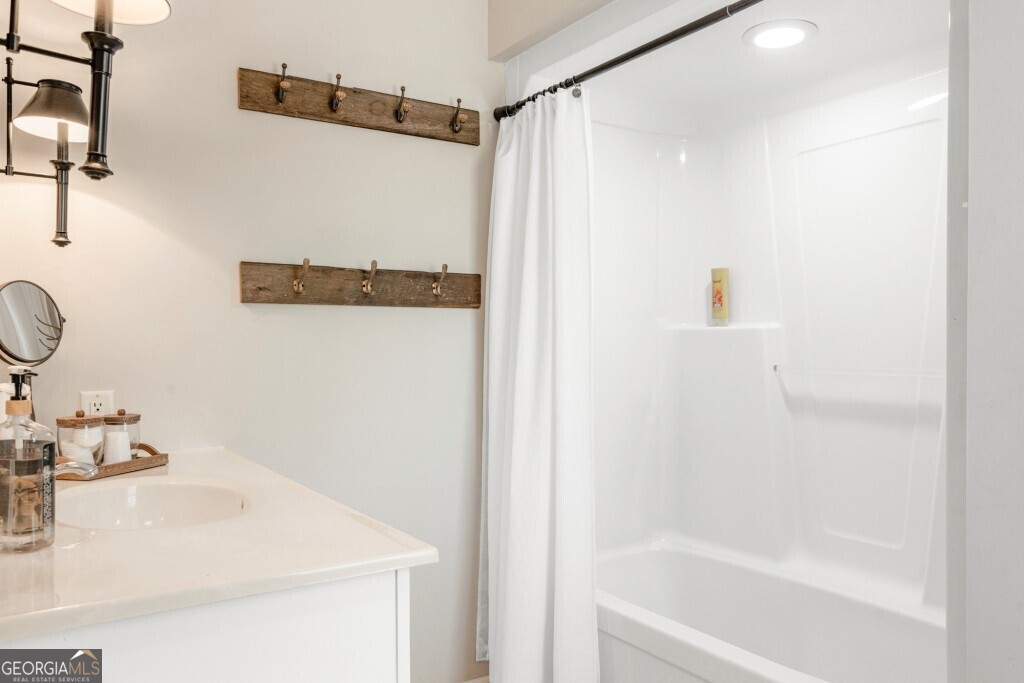 426 Wadley Coleman Lake Road Swainsboro, GA 30401 - Photo 38 of 79 a bathroom with a sink and a mirror