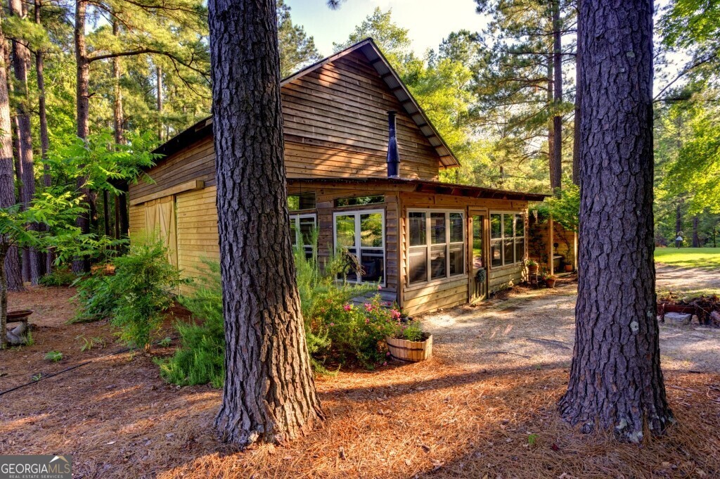 426 Wadley Coleman Lake Road Swainsboro, GA 30401 - Photo 45 of 79 a view of a house with backyard and a tree