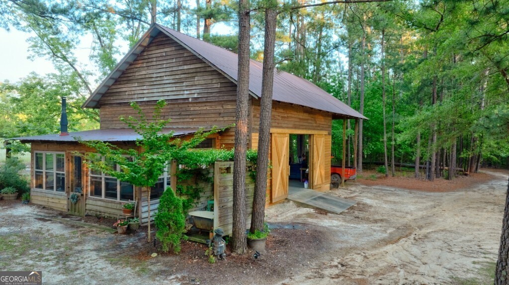 426 Wadley Coleman Lake Road Swainsboro, GA 30401 - Photo 46 of 79 a view of a house with backyard and sitting area