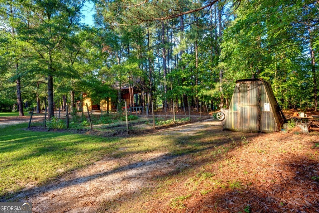 426 Wadley Coleman Lake Road Swainsboro, GA 30401 - Photo 69 of 79 a view of a playground with basketball court