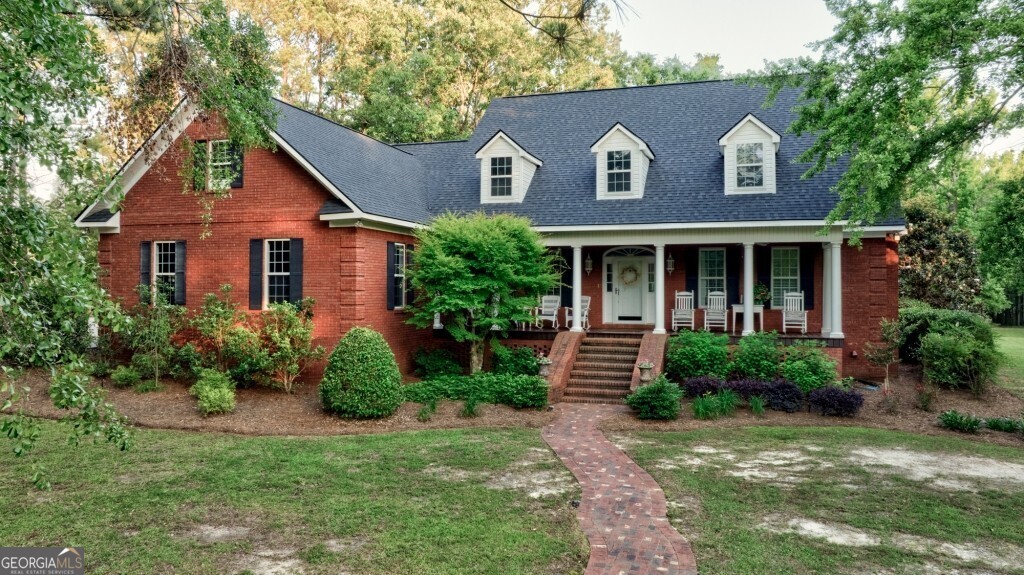 426 Wadley Coleman Lake Road Swainsboro, GA 30401 - Photo 9 of 79 front view of brick house with a yard