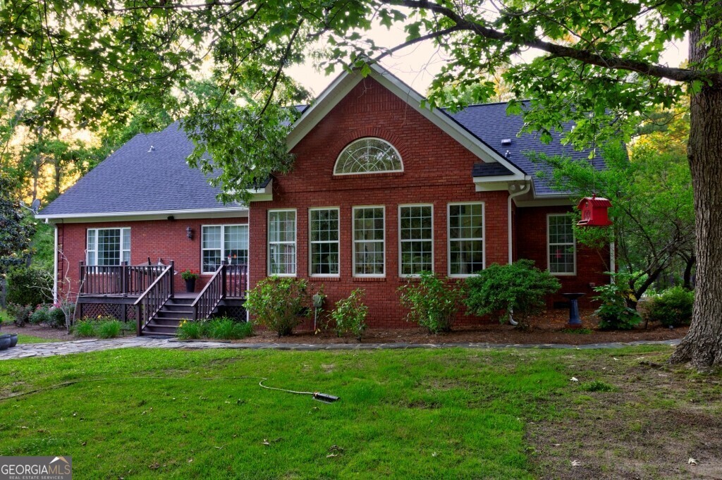 426 Wadley Coleman Lake Road Swainsboro, GA 30401 - Photo 10 of 79 a front view of a house with garden