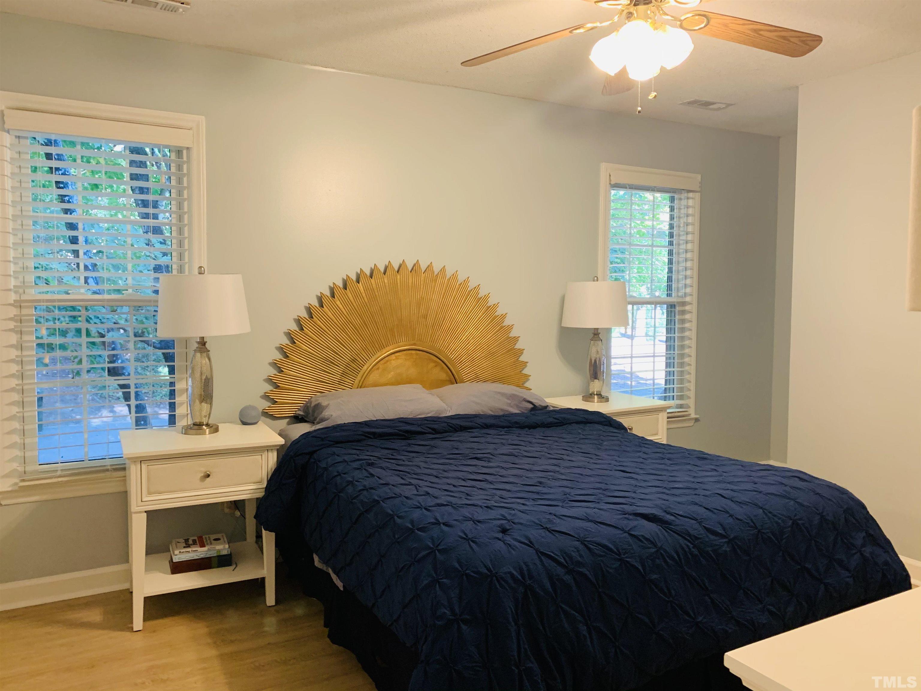 4609 Hershey Court Raleigh, NC 27613 - Photo 14 of 26 a bedroom with a bed and window