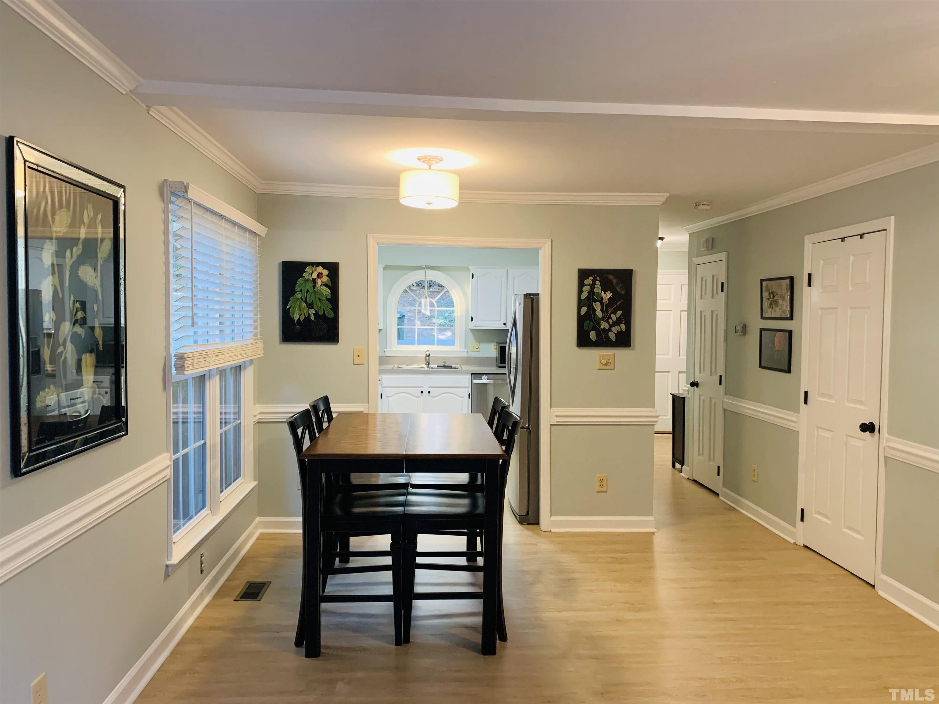 4609 Hershey Court Raleigh, NC 27613 - Photo 22 of 26 a dining room with furniture and window