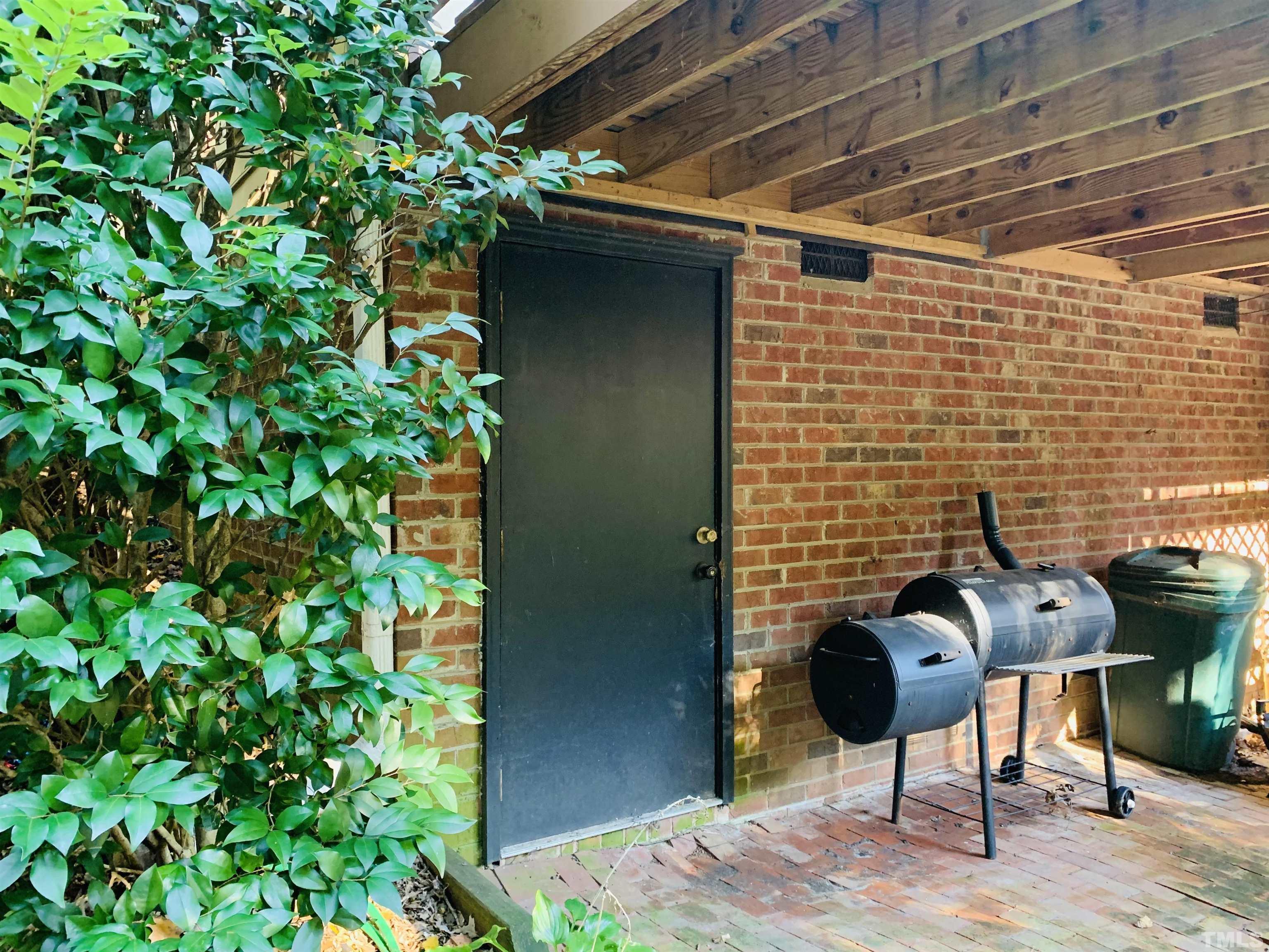 4609 Hershey Court Raleigh, NC 27613 - Photo 5 of 26 a backyard of a house with seating space
