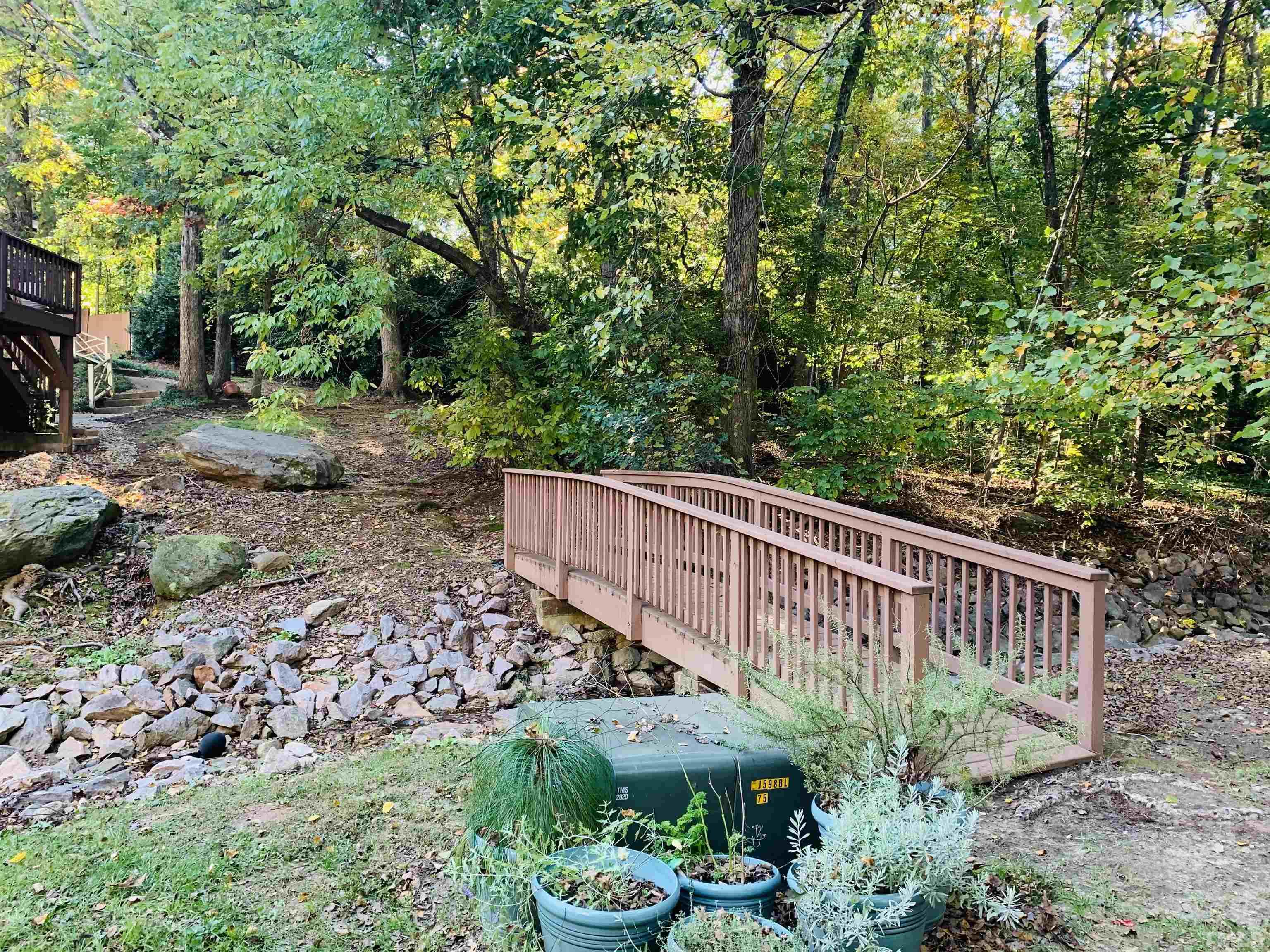 4609 Hershey Court Raleigh, NC 27613 - Photo 8 of 26 a view of a garden with wooden fence