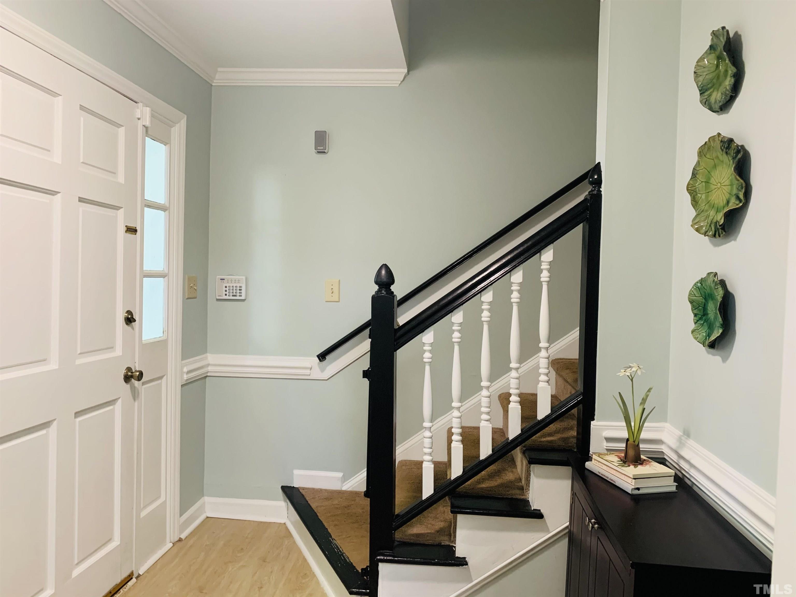 4609 Hershey Court Raleigh, NC 27613 - Photo 10 of 26 a view of entryway with wooden floor and windows