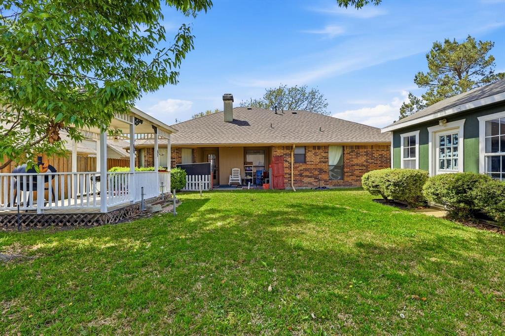 324 Bowie Street Forney, TX 75126 - Photo 21 of 25 a front view of a house with a yard table and chairs