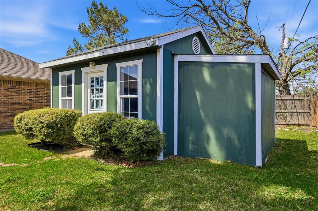 324 Bowie Street Forney, TX 75126 - Photo 22 of 25 a view of a back yard of the house