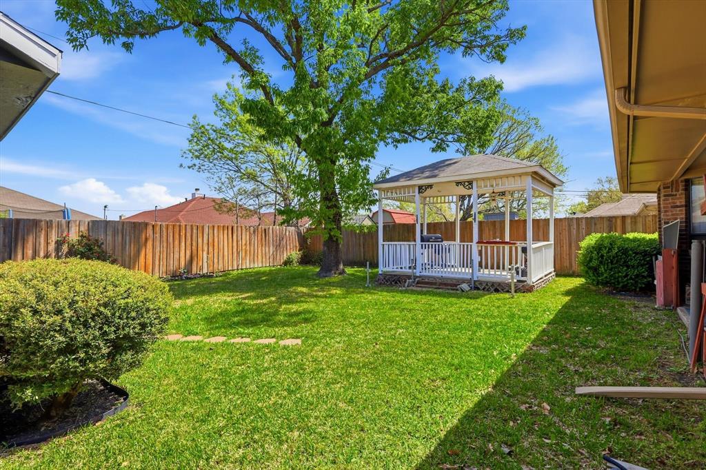 324 Bowie Street Forney, TX 75126 - Photo 24 of 25 a view of a house with backyard and sitting area