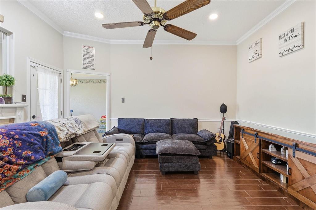 324 Bowie Street Forney, TX 75126 - Photo 4 of 25 a living room with furniture and a couch