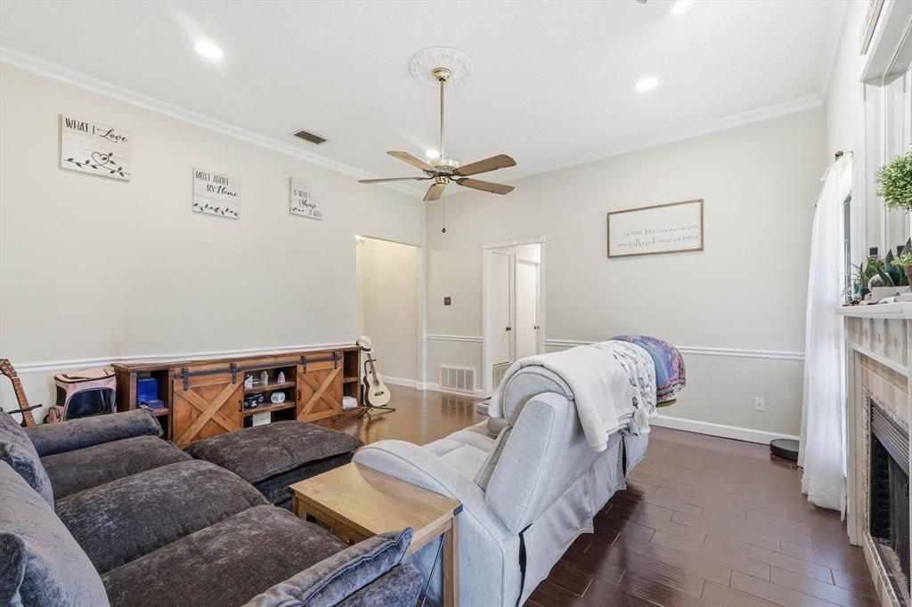 324 Bowie Street Forney, TX 75126 - Photo 5 of 25 a living room with furniture and a ceiling fan
