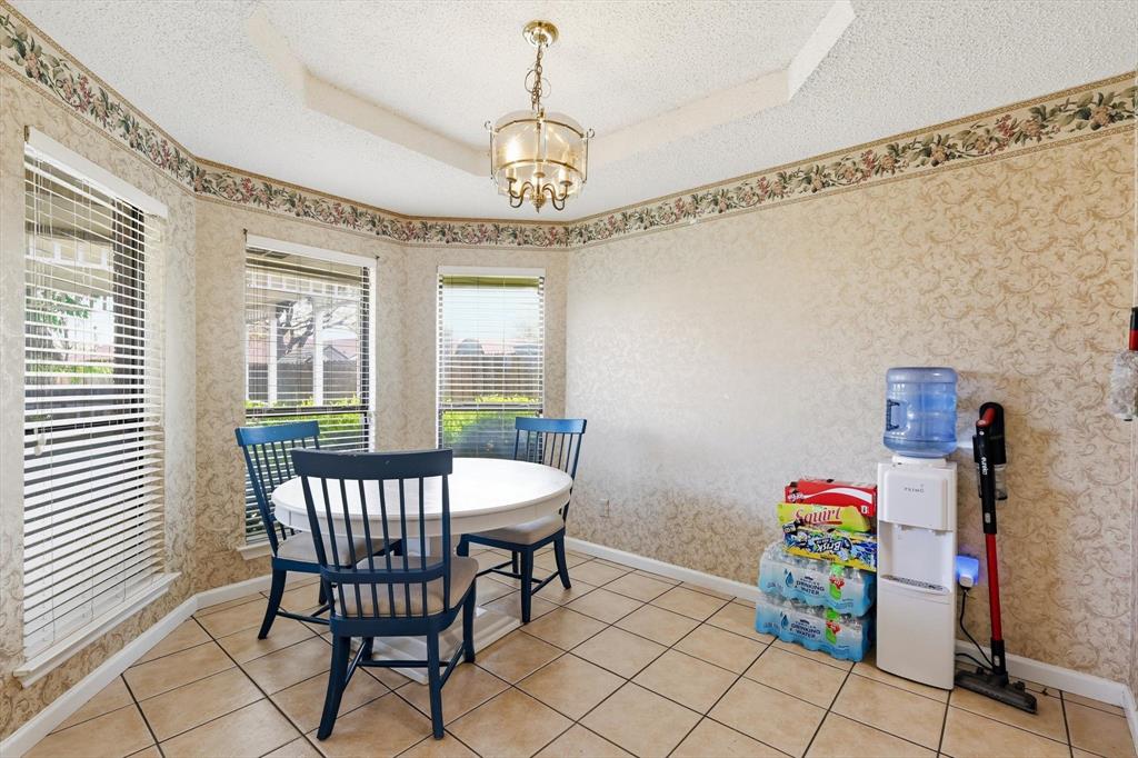 324 Bowie Street Forney, TX 75126 - Photo 9 of 25 a view of a dining room with furniture window and outside view