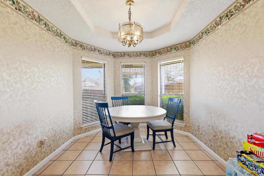 324 Bowie Street Forney, TX 75126 - Photo 10 of 25 a dining room with furniture and window