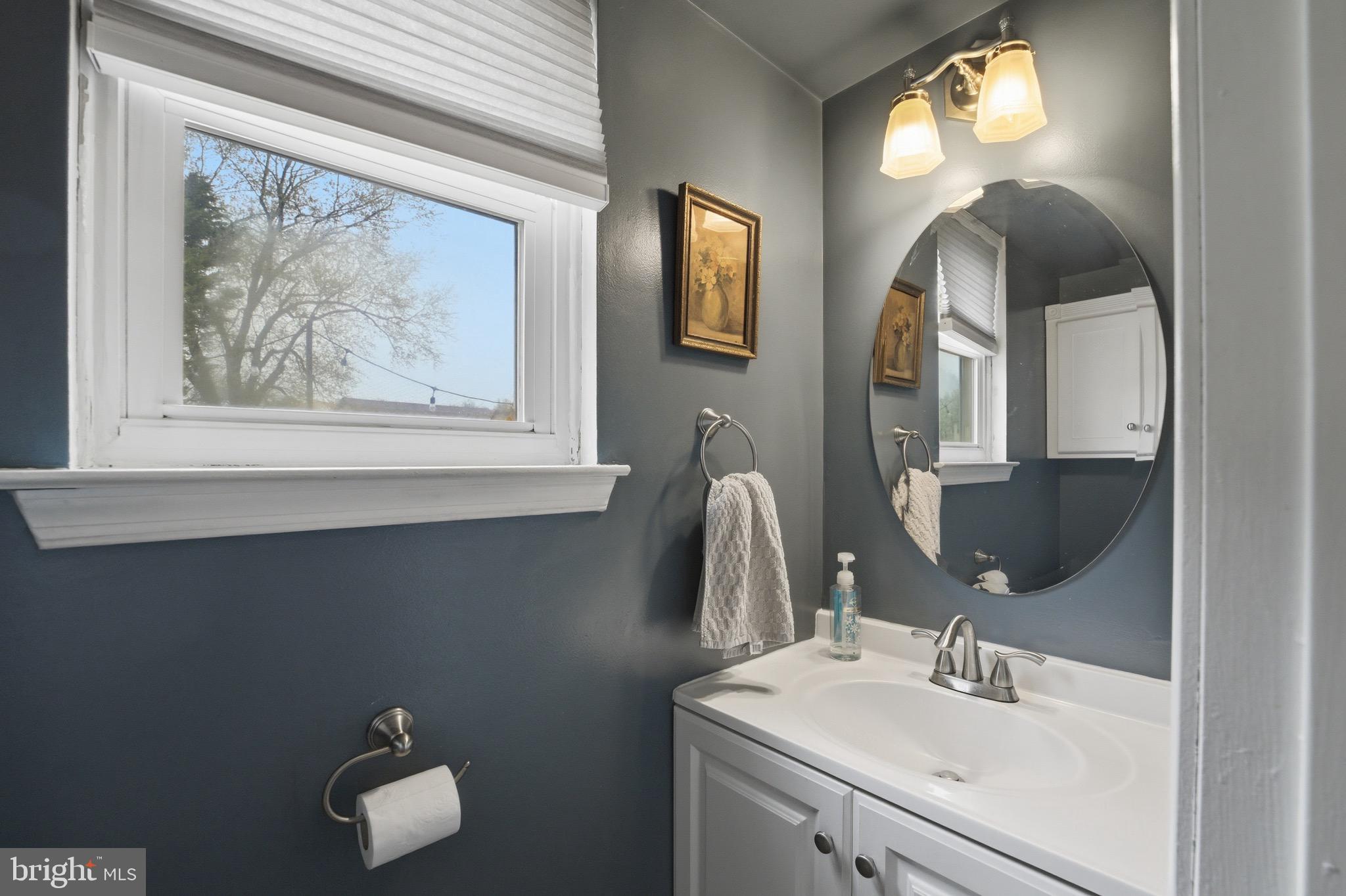 14 Woodhurst Drive Mount Holly, NJ 08060 - Photo 13 of 24 a bathroom with a sink and a mirror