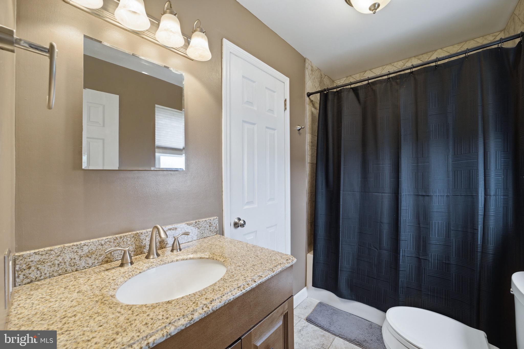 14 Woodhurst Drive Mount Holly, NJ 08060 - Photo 15 of 24 a bathroom with a granite countertop sink vanity mirror and toilet