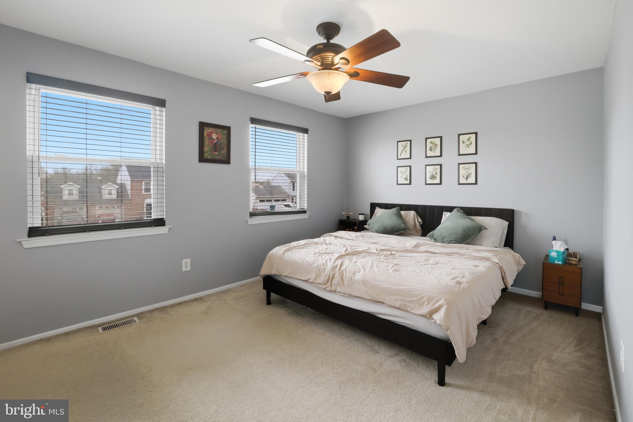 14 Woodhurst Drive Mount Holly, NJ 08060 - Photo 17 of 24 a bedroom with a large bed and a window