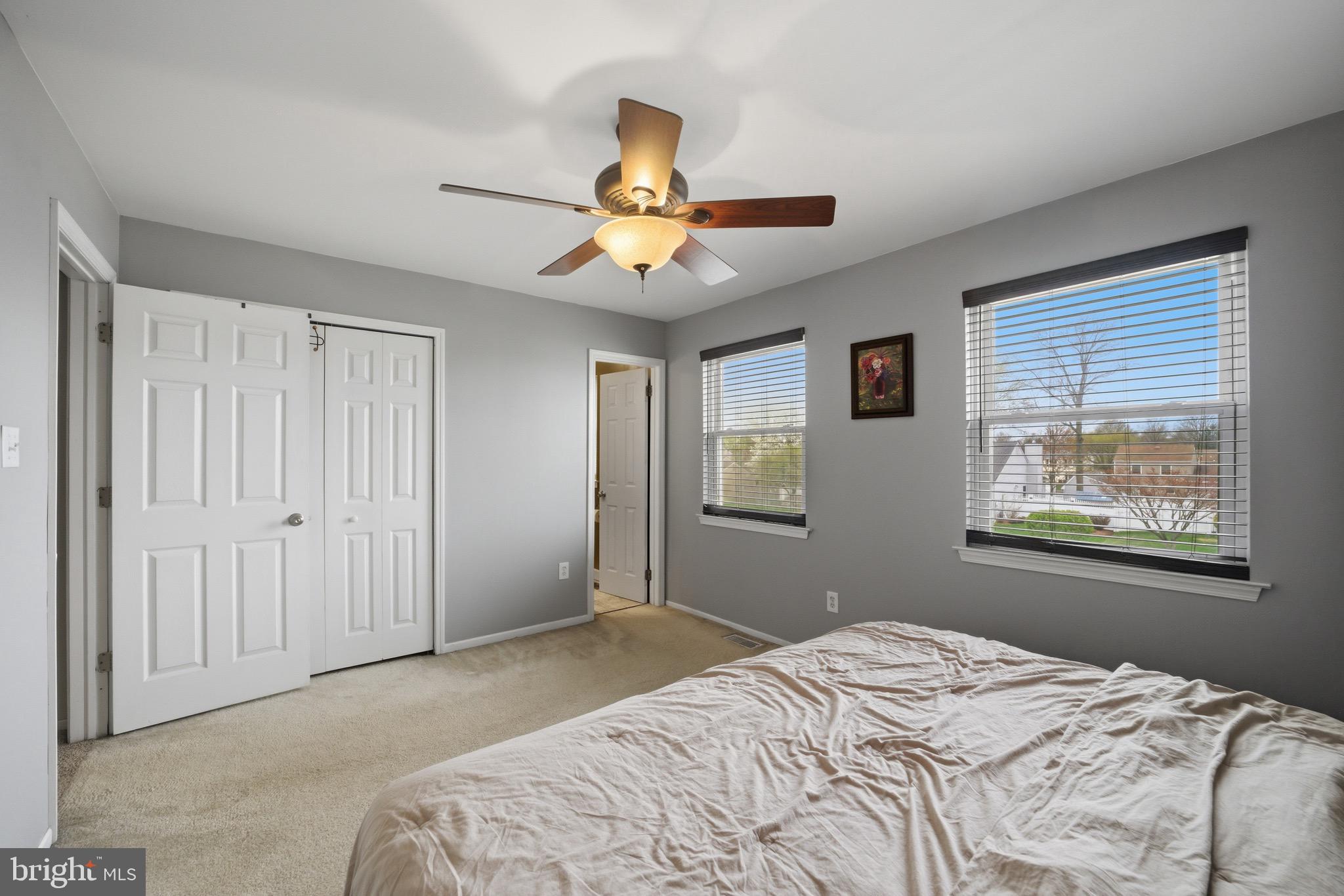 14 Woodhurst Drive Mount Holly, NJ 08060 - Photo 18 of 24 a bedroom with a bed and a chandelier