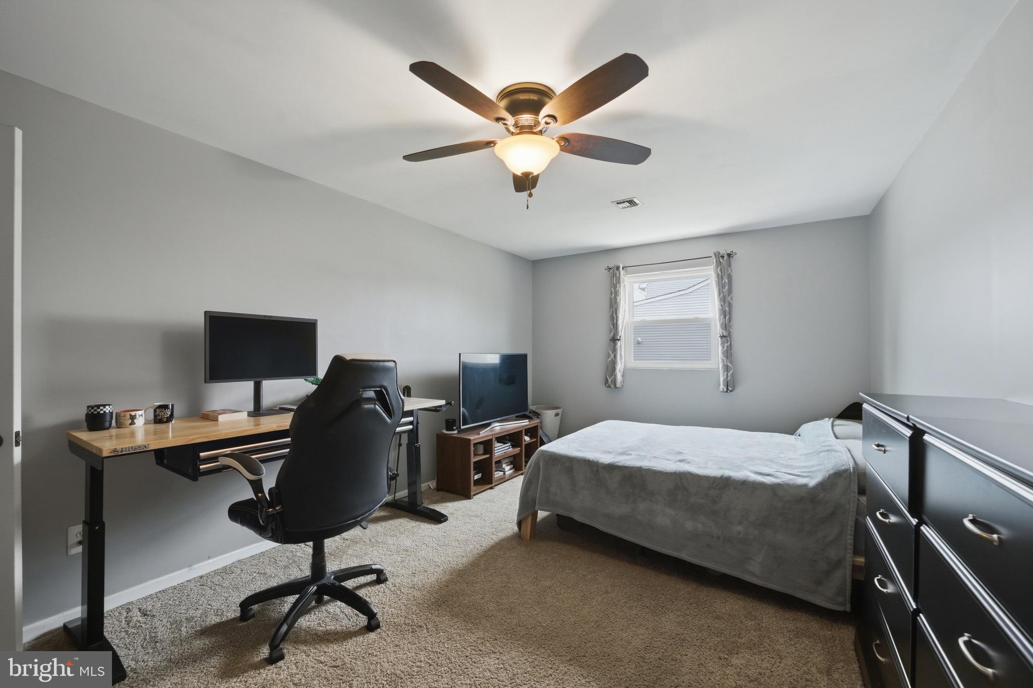 14 Woodhurst Drive Mount Holly, NJ 08060 - Photo 21 of 24 a bedroom with a bed and a window