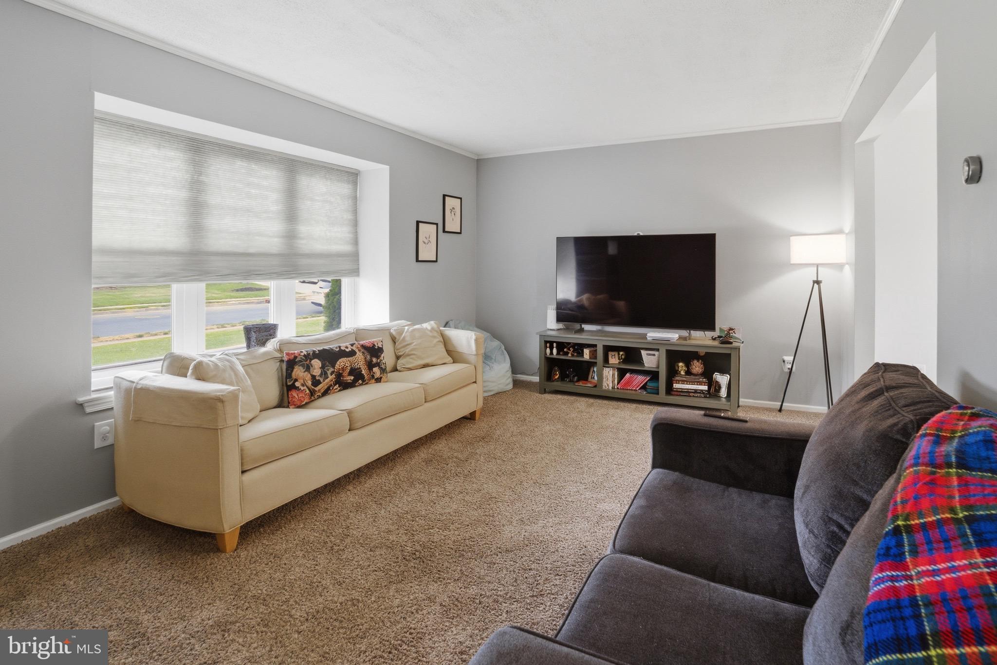14 Woodhurst Drive Mount Holly, NJ 08060 - Photo 5 of 24 a living room with furniture and a flat screen tv