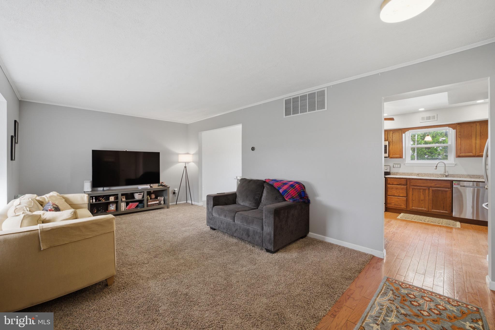14 Woodhurst Drive Mount Holly, NJ 08060 - Photo 6 of 24 a living room with furniture and a flat screen tv