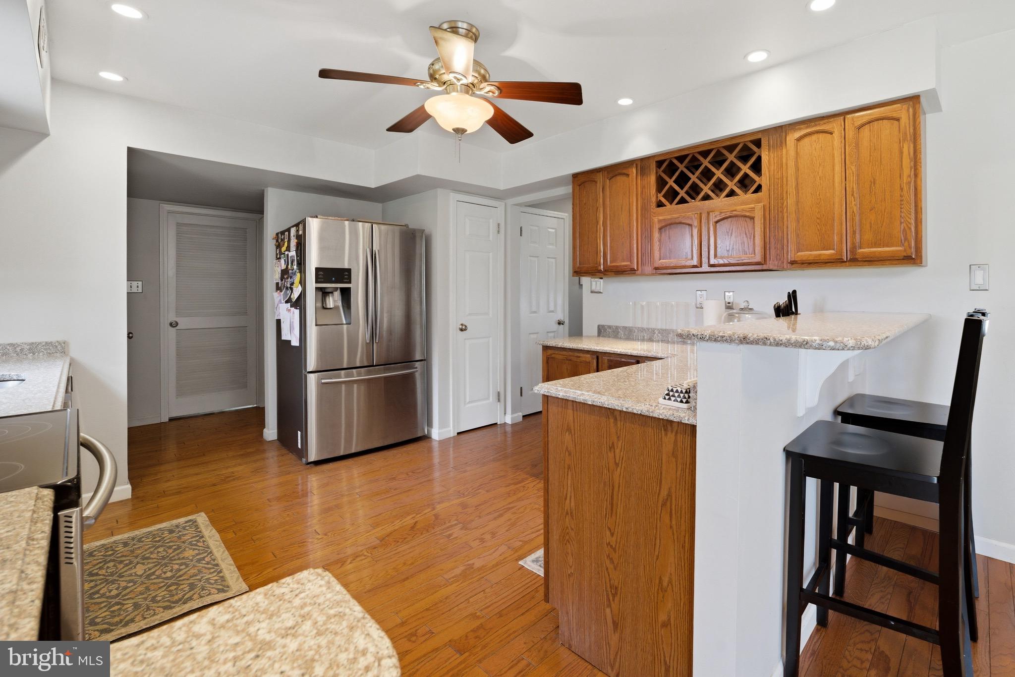 14 Woodhurst Drive Mount Holly, NJ 08060 - Photo 8 of 24 a kitchen with stainless steel appliances kitchen island granite countertop a refrigerator and a stove top oven