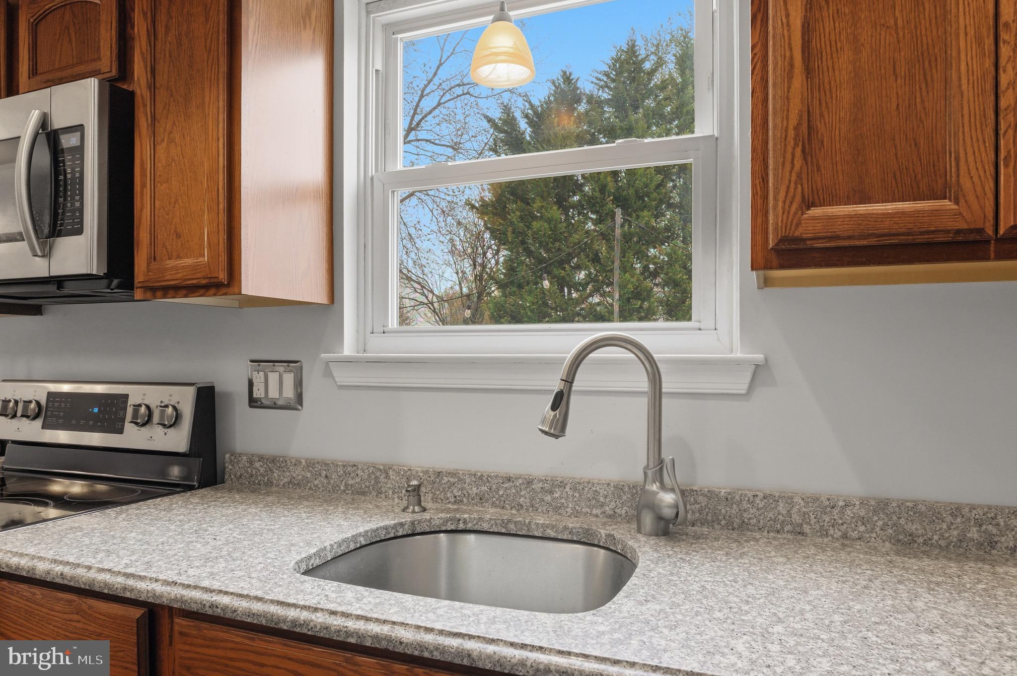 14 Woodhurst Drive Mount Holly, NJ 08060 - Photo 10 of 24 a kitchen with a sink and a window