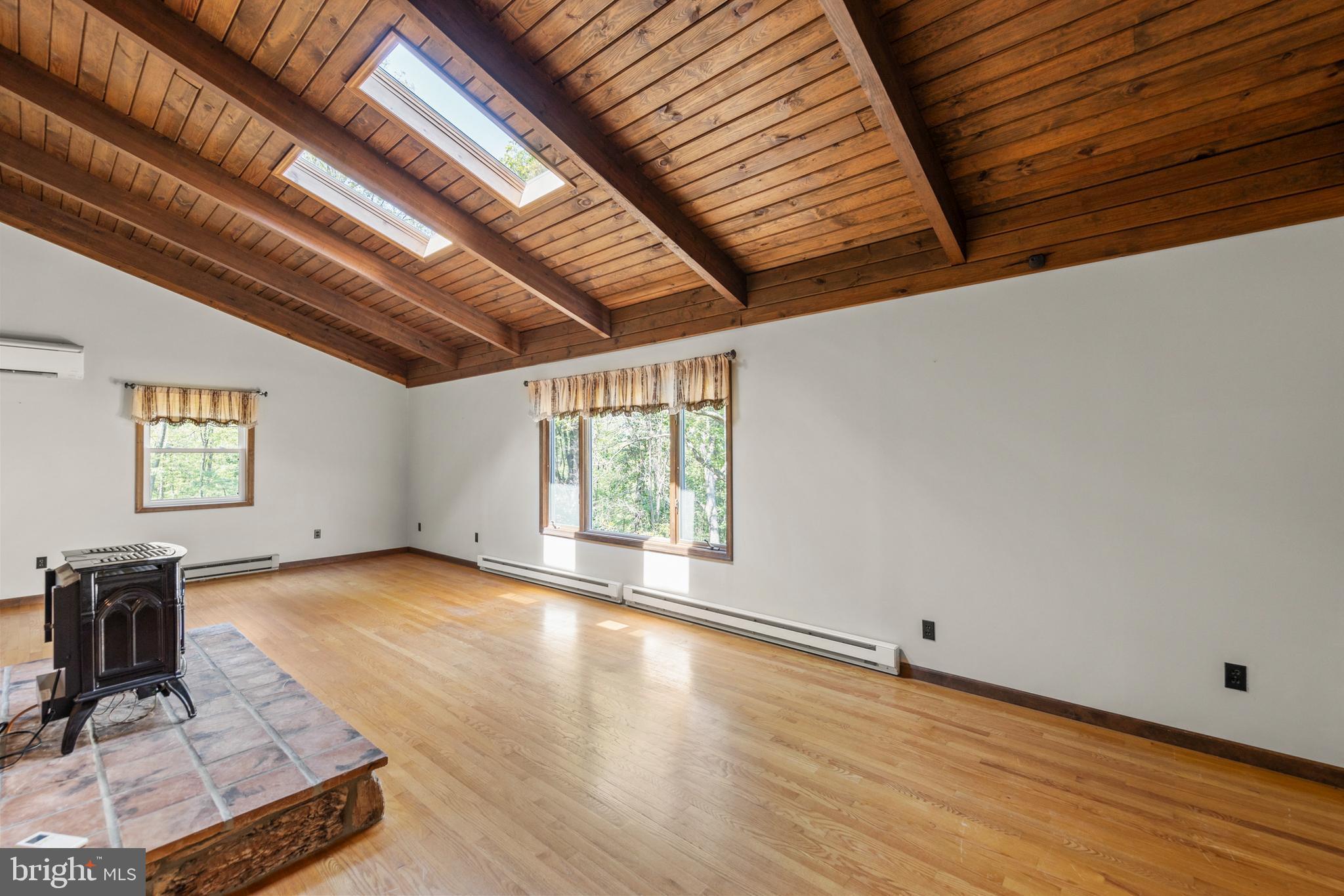 170 Frye Path Road Gore, VA 22637 - Photo 15 of 50 a view of a room with wooden floor and windows