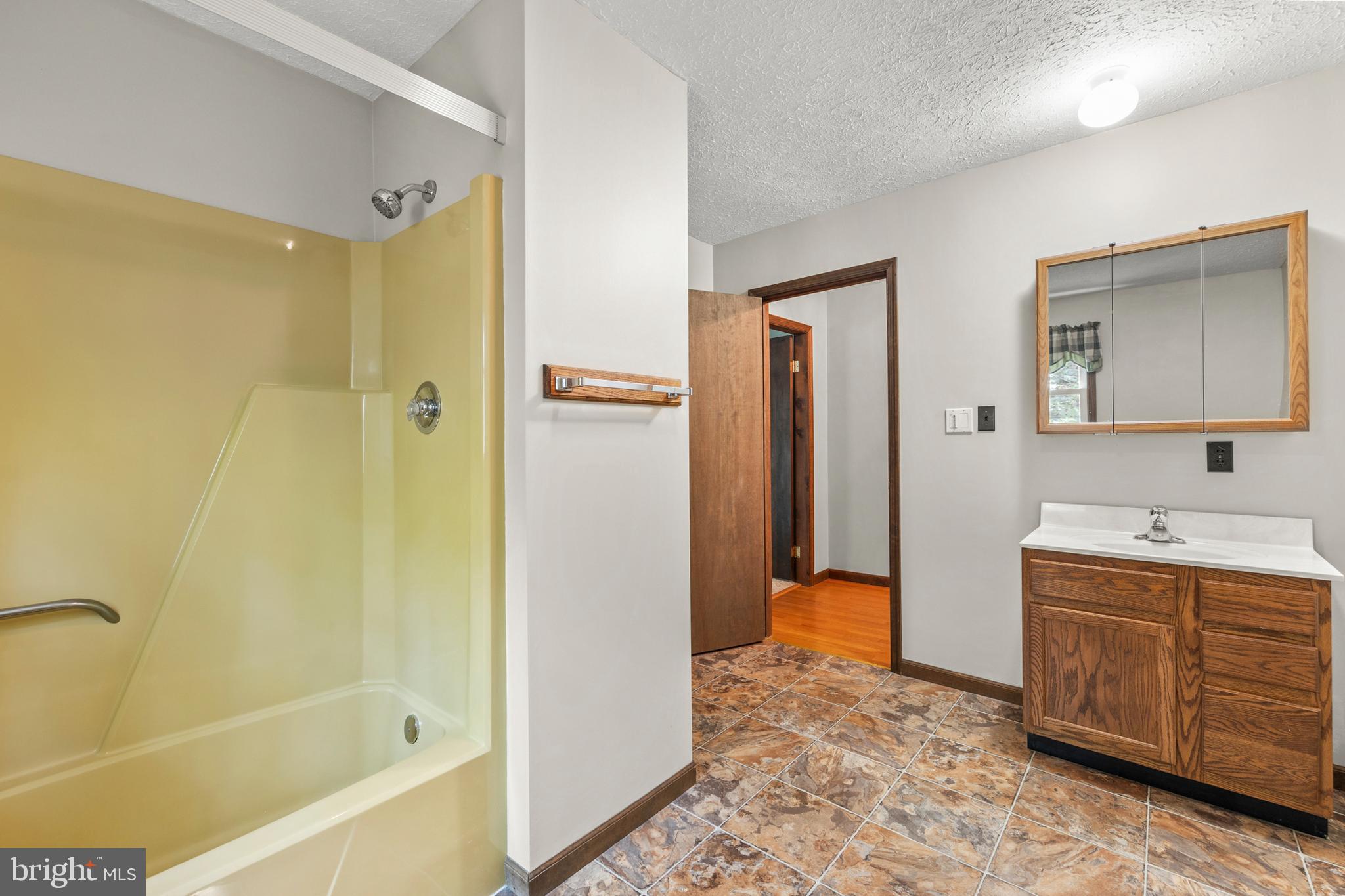 170 Frye Path Road Gore, VA 22637 - Photo 23 of 50 a bathroom with a tub sink and mirror