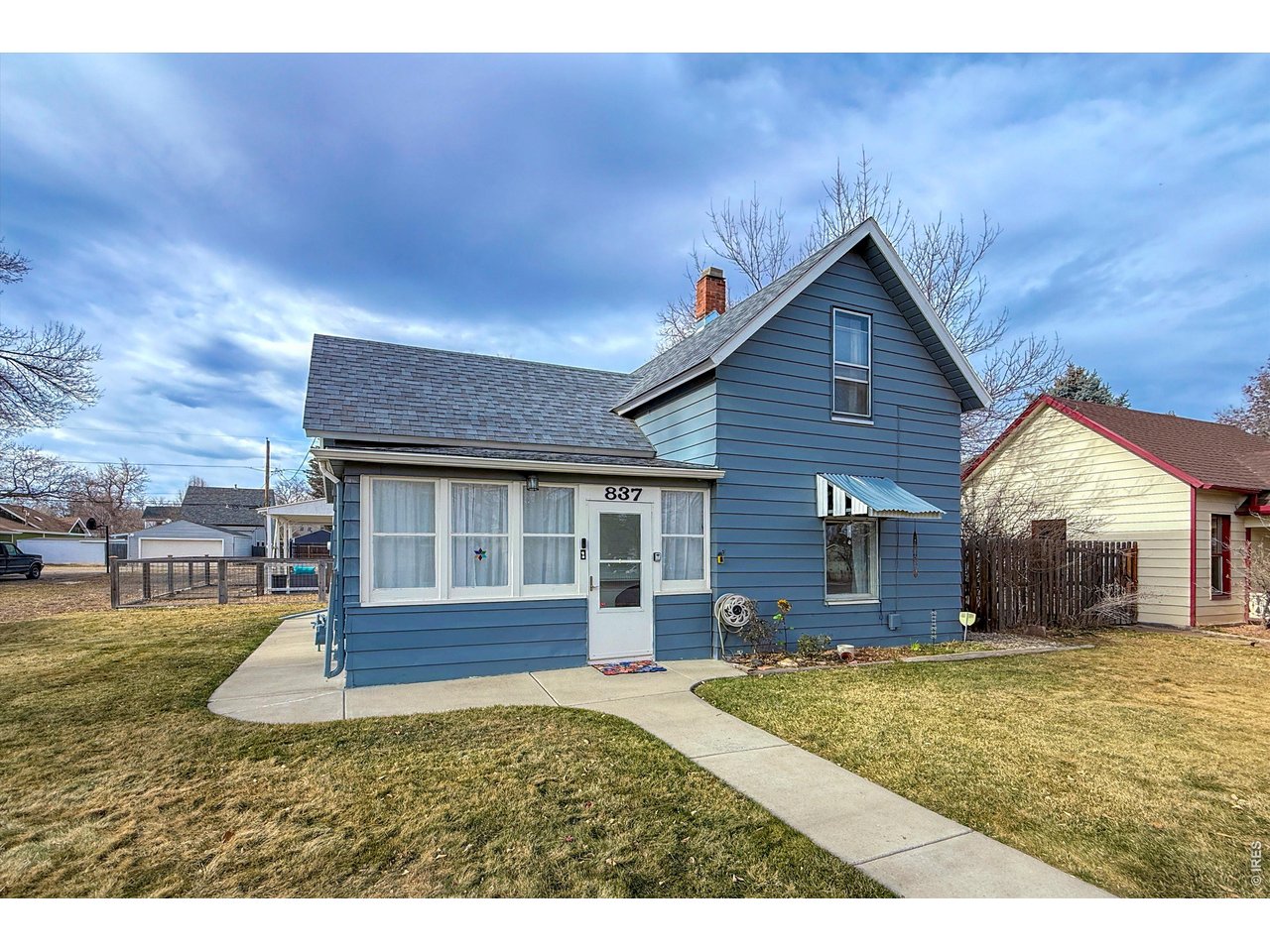 837 5th Street Berthoud, CO 80513 - Photo 1 of 36 a view of a house with yard and porch