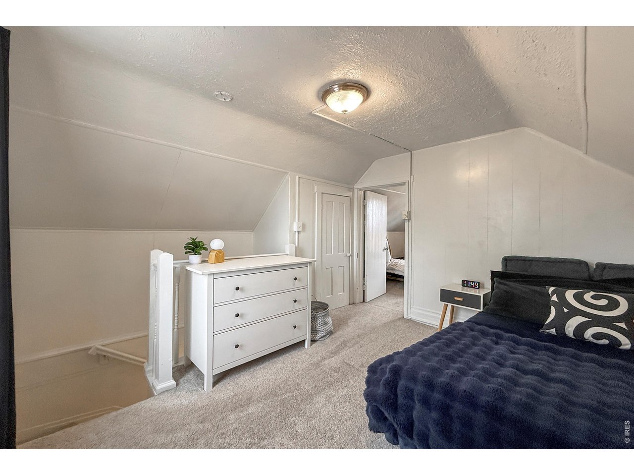 837 5th Street Berthoud, CO 80513 - Photo 21 of 36 a bedroom with a bed and a dresser