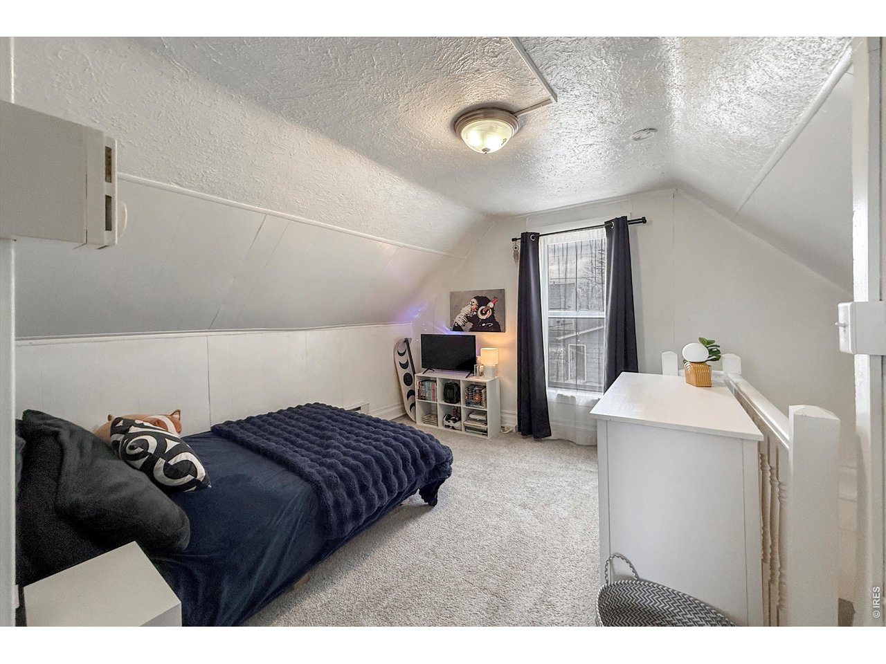 837 5th Street Berthoud, CO 80513 - Photo 22 of 36 a bedroom with a bed and a cabinets