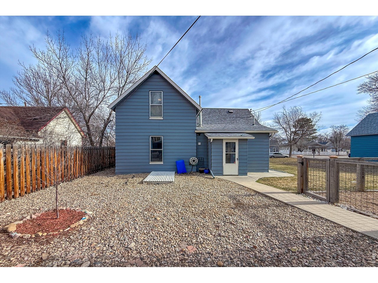 837 5th Street Berthoud, CO 80513 - Photo 25 of 36 a house view with a backyard space