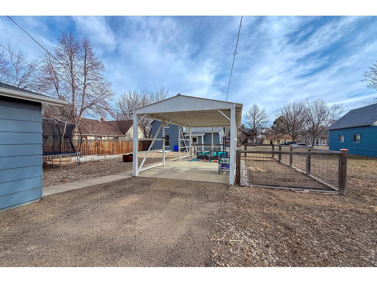 837 5th Street Berthoud, CO 80513 - Photo 30 of 36 a view of road with large trees