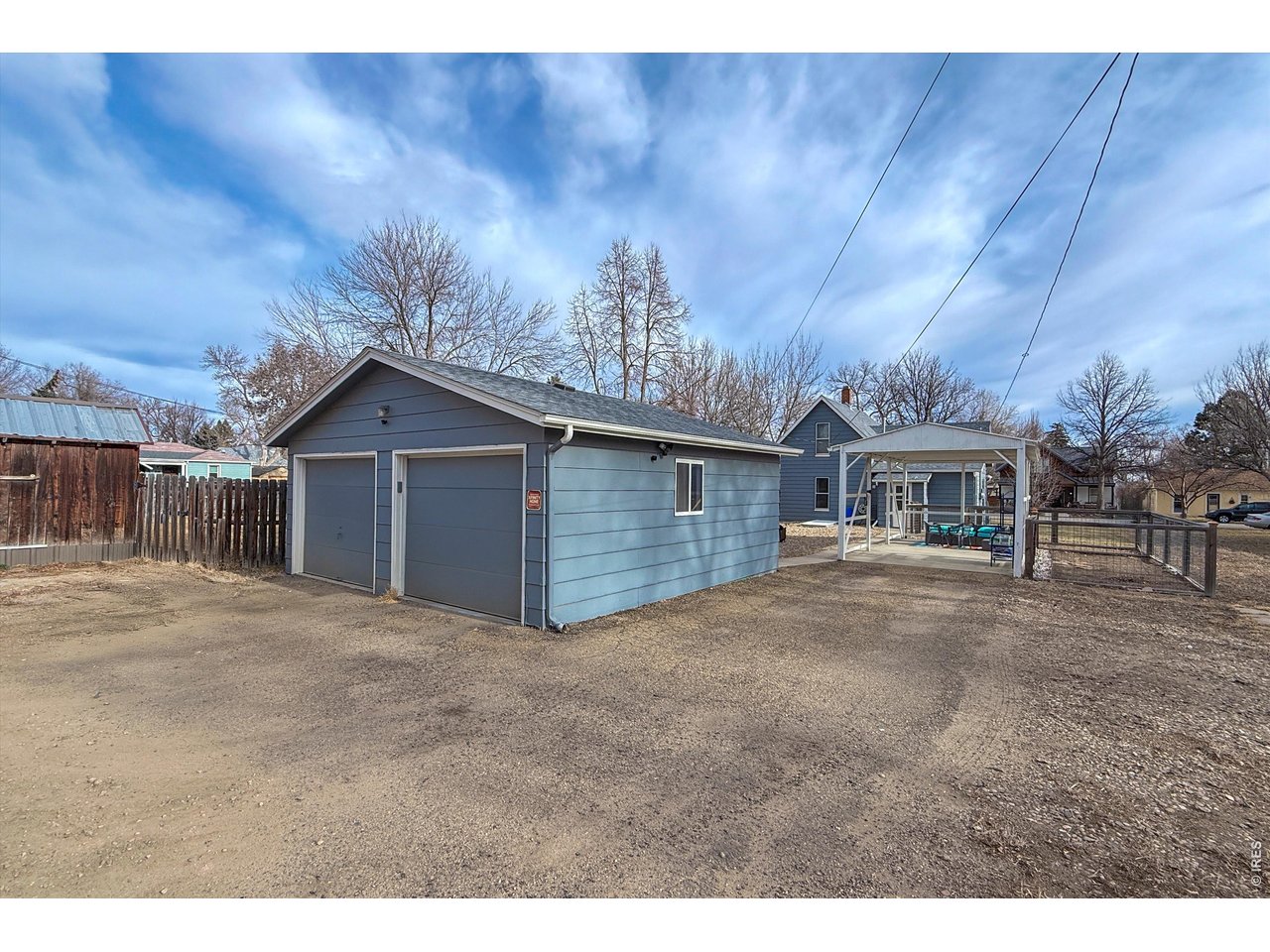 837 5th Street Berthoud, CO 80513 - Photo 32 of 36 a view of a house with a yard