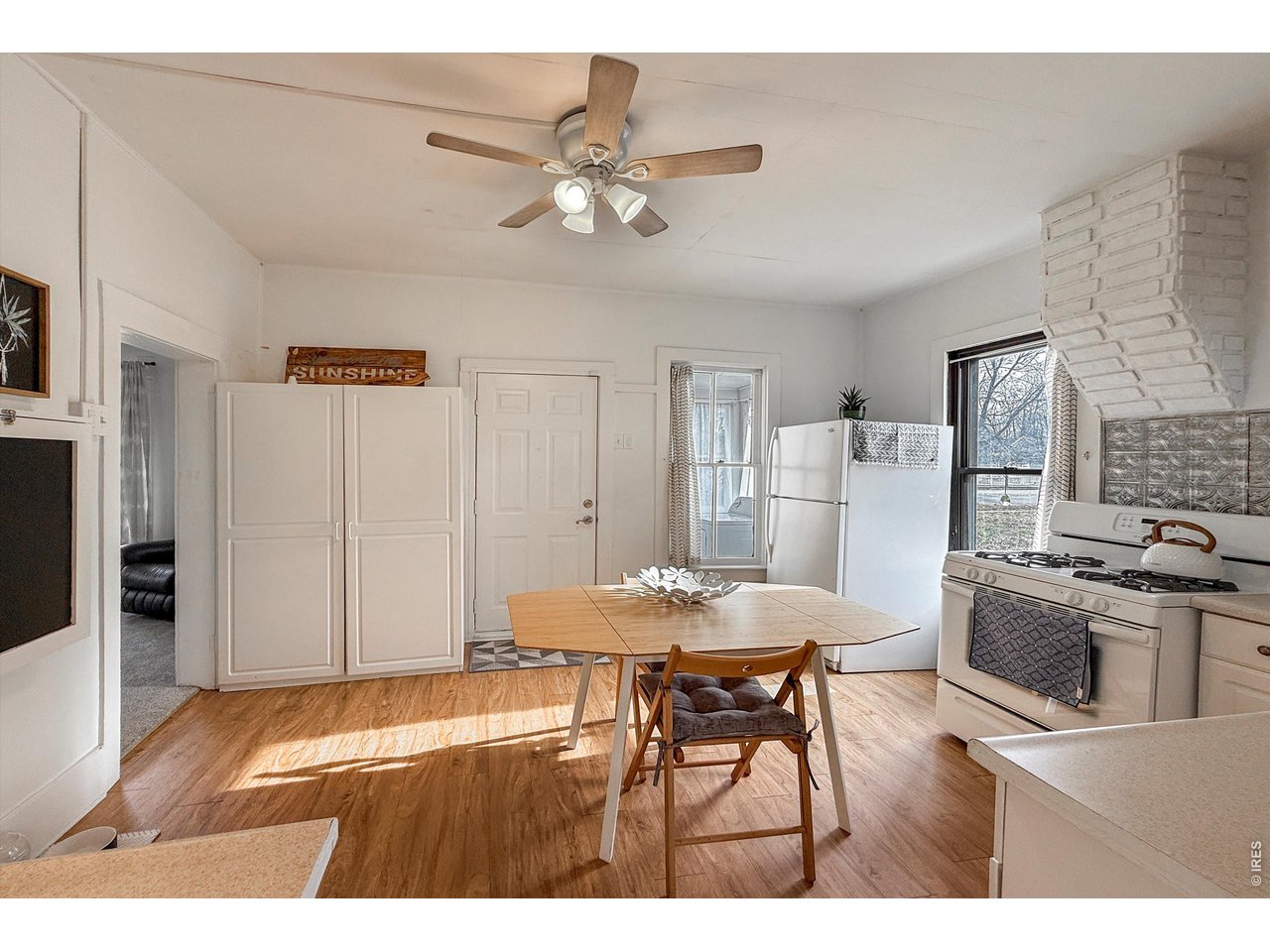 837 5th Street Berthoud, CO 80513 - Photo 8 of 36 a view of a dining room with furniture and wooden floor