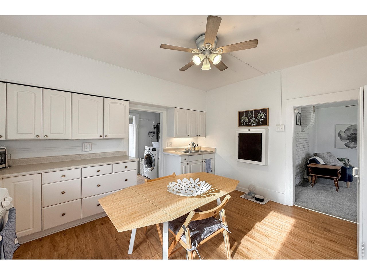 837 5th Street Berthoud, CO 80513 - Photo 9 of 36 a living room with furniture and wooden floor